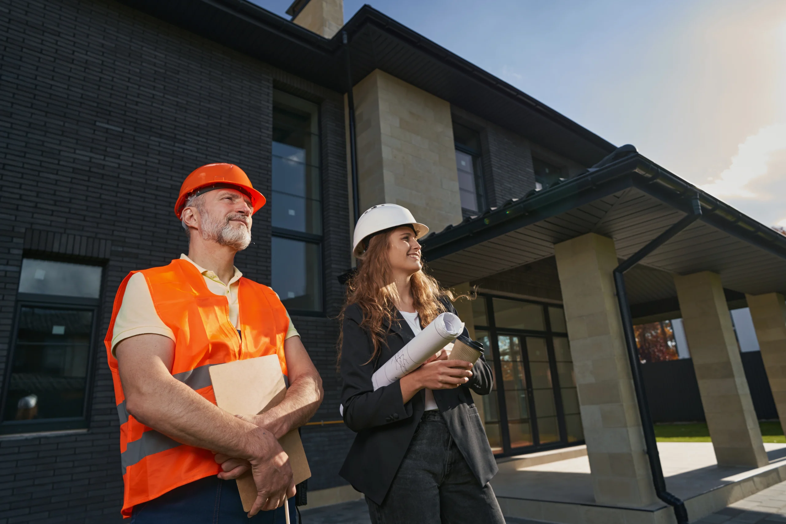 pleased-builder-and-woman-engineer-standing-before-2025-03-08-15-26-17-utc